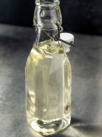large glass bottle of homemade simple syrup