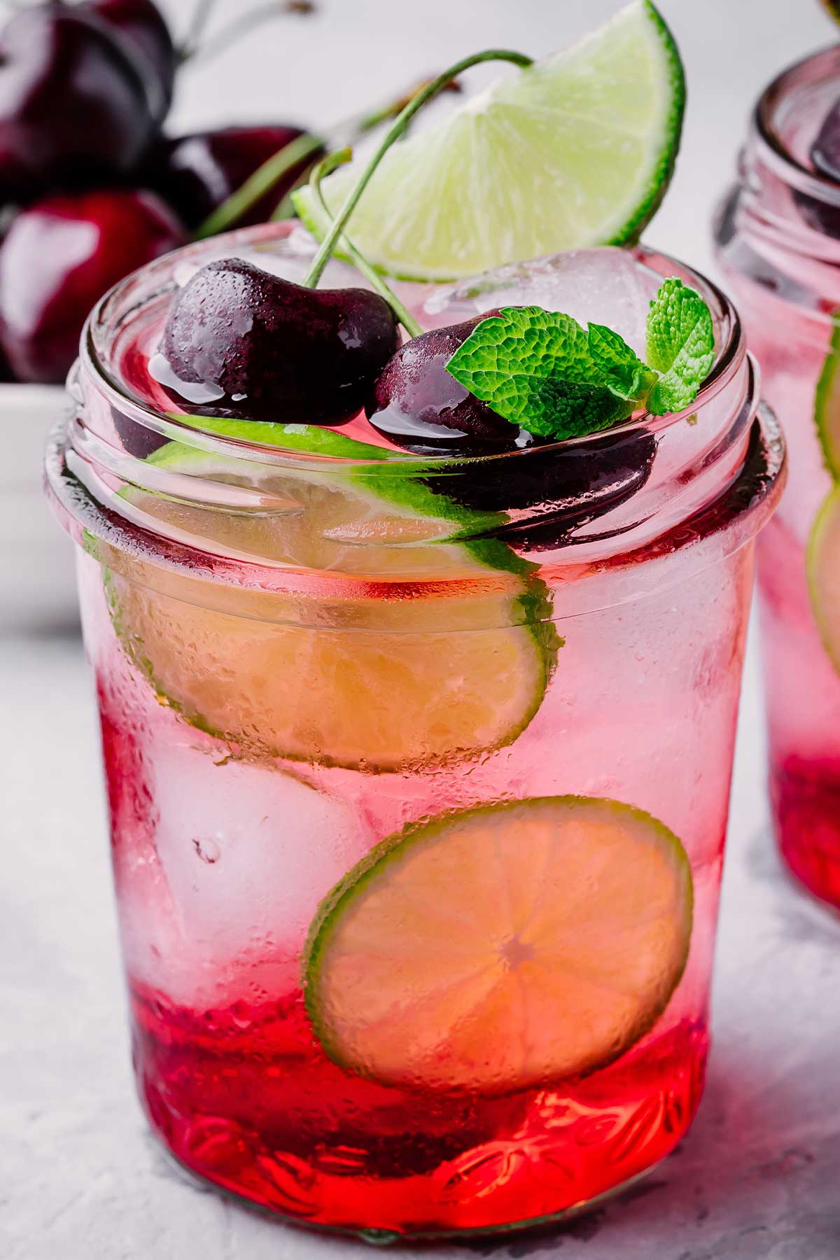 closeup of glass jar of cherry limemade abigailejohnson