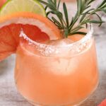 a glass of mezcal paloma