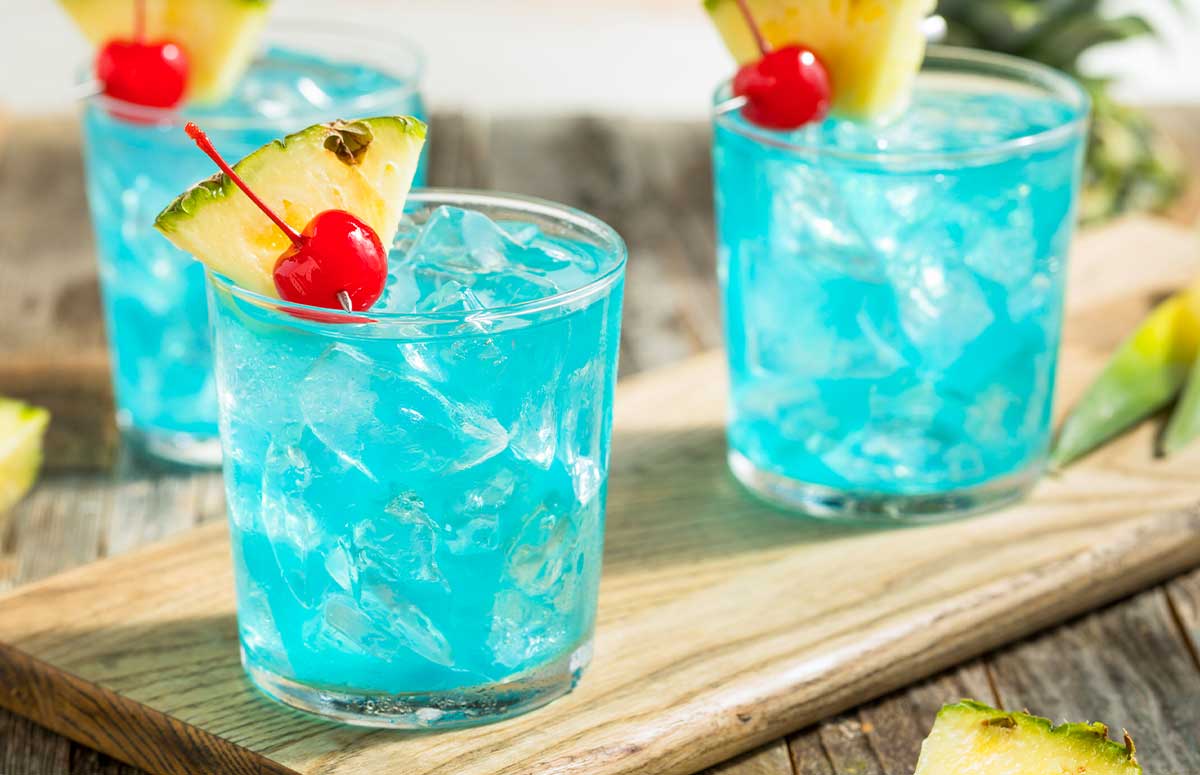 three blue 体检强奷小箩莉小说 garnished with cherries and chopped pineapple