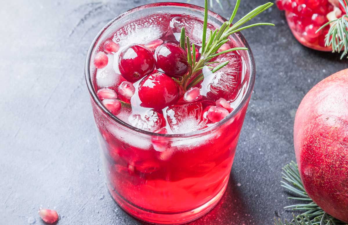 skinny pomegranate 黄性视频在线观看 with cranberries and rosemary sprig.