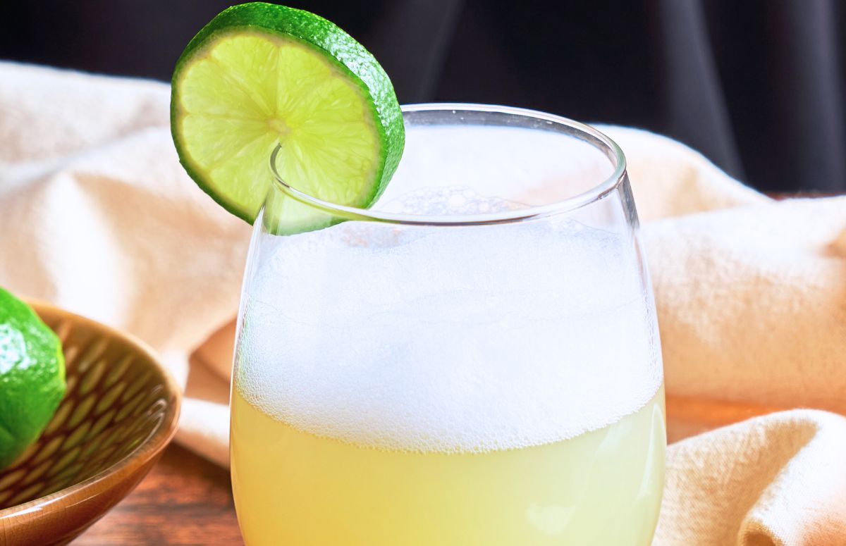 Mezcal Sour with a lime slice